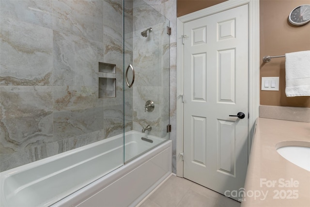 full bathroom with vanity, bath / shower combo with glass door, and tile patterned floors