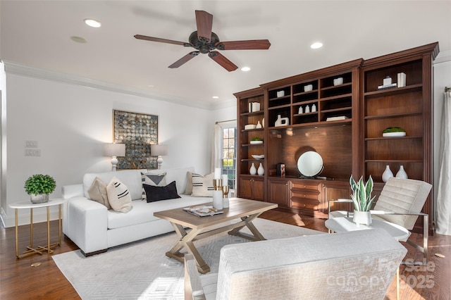 living area with a ceiling fan, light wood-type flooring, crown molding, and recessed lighting