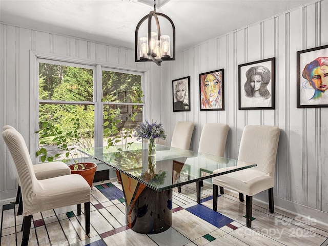 dining area with an inviting chandelier