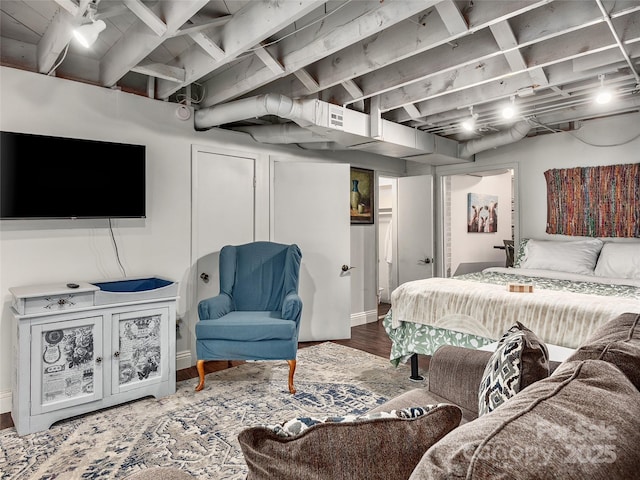 bedroom with hardwood / wood-style flooring