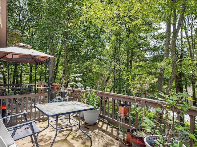 wooden terrace with a gazebo