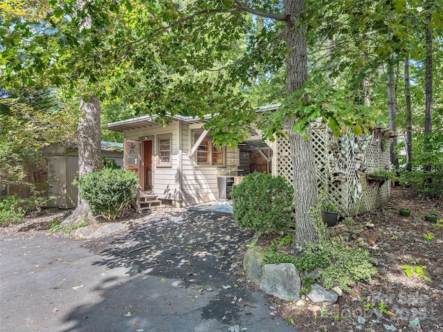 view of property hidden behind natural elements