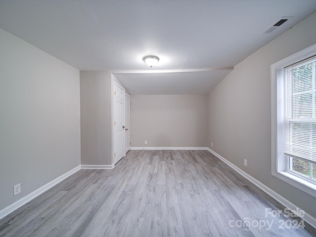 spare room with light hardwood / wood-style flooring