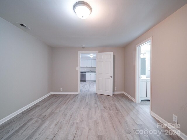 unfurnished room featuring light hardwood / wood-style floors