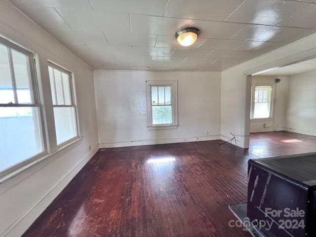 spare room featuring dark hardwood / wood-style flooring