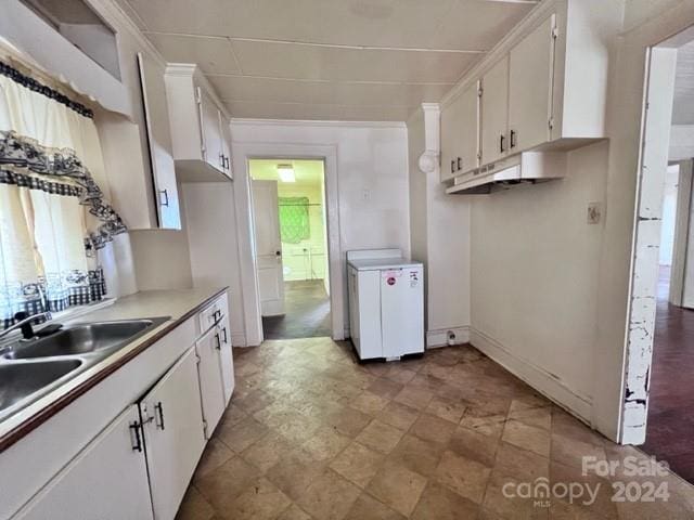 kitchen with white cabinetry and sink