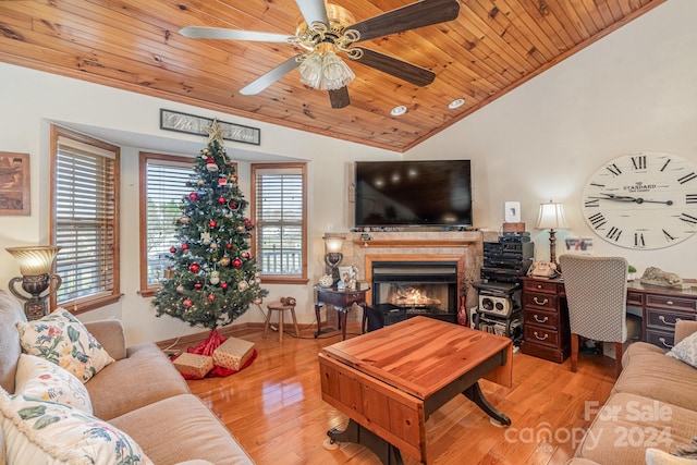 living room with vaulted ceiling, light hardwood / wood-style flooring, ceiling fan, ornamental molding, and wood ceiling