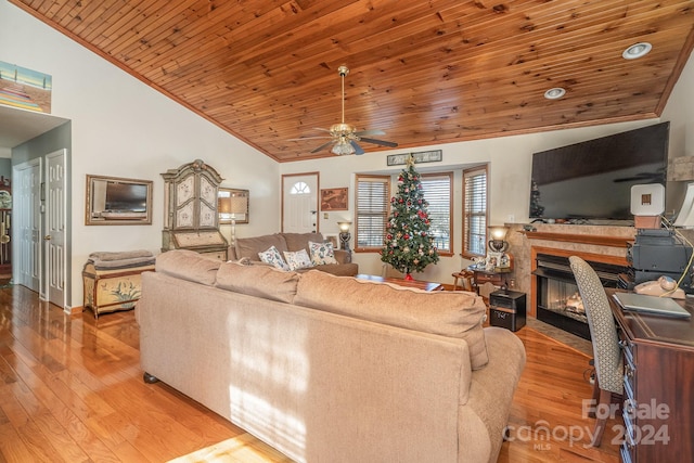 living room with ceiling fan, light wood-type flooring, high vaulted ceiling, and wooden ceiling