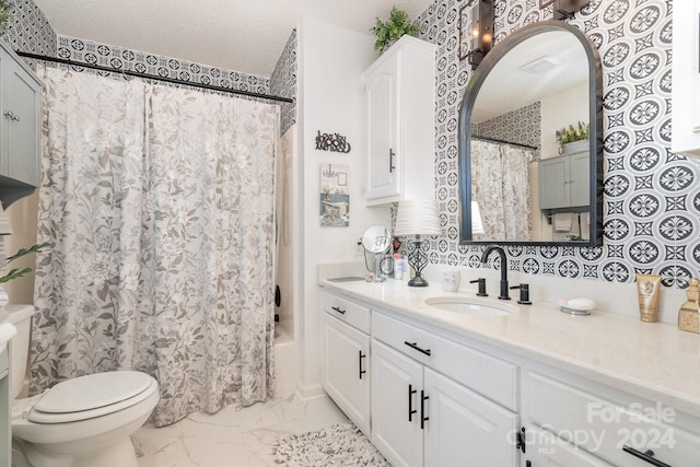 full bathroom with vanity, shower / bath combination with curtain, a textured ceiling, and toilet