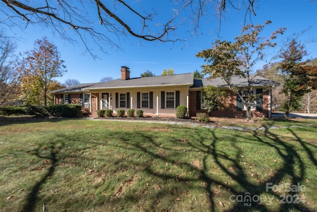 single story home with a porch and a front yard