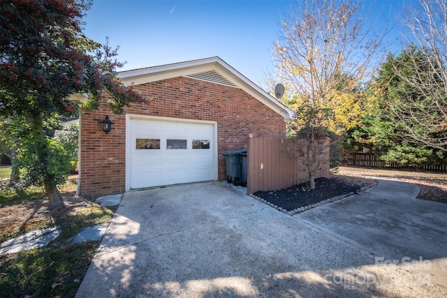 view of side of property featuring a garage