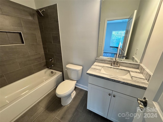 full bathroom with vanity, toilet, and tiled shower / bath