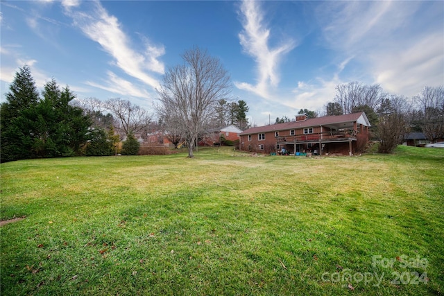 view of yard with a wooden deck