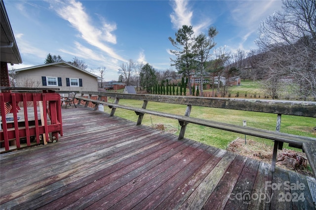 wooden terrace with a yard