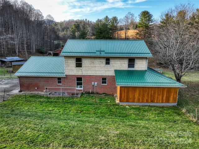 back of house with a yard