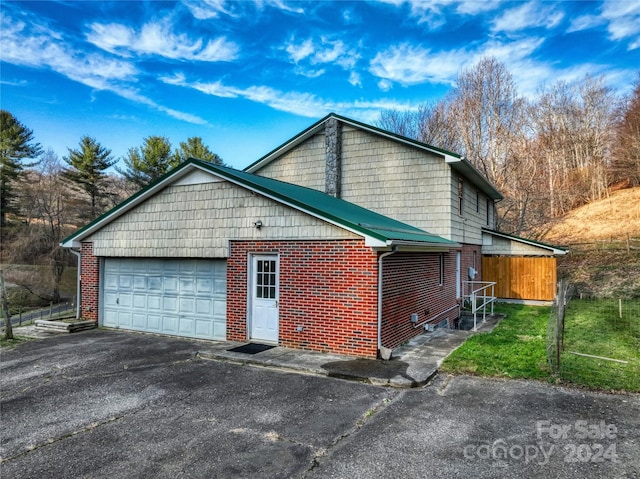 view of property exterior featuring a garage