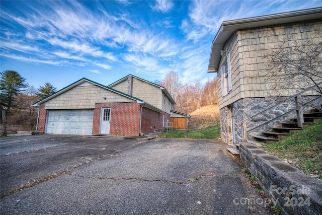 view of property exterior with a garage