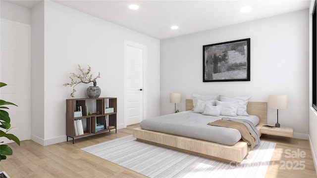 bedroom with light hardwood / wood-style flooring