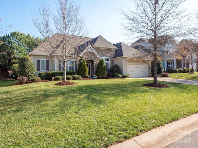 single story home with a garage and a front lawn