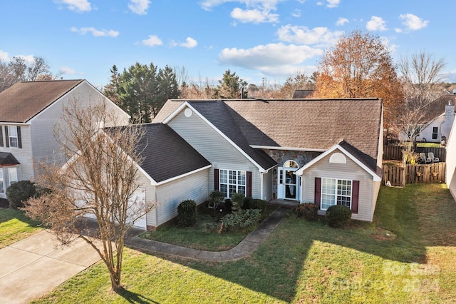 single story home with a front lawn