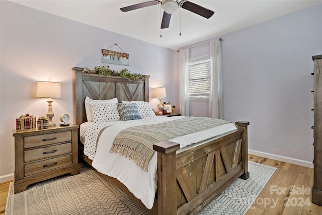 bedroom featuring light wood-type flooring and ceiling fan