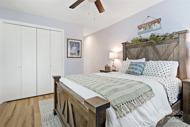 bedroom with a closet, ceiling fan, and light hardwood / wood-style flooring