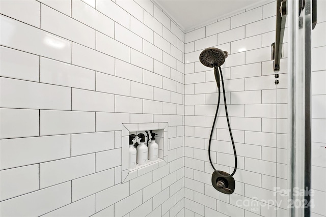 bathroom with tiled shower