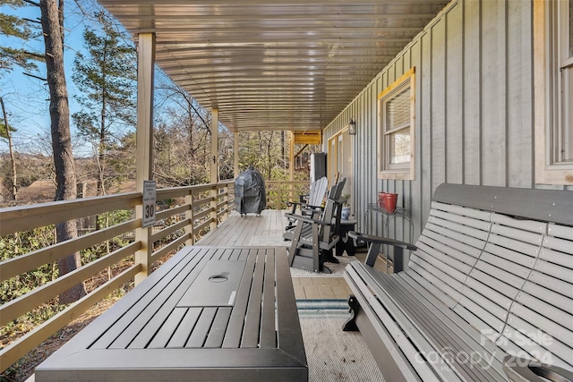 wooden terrace with area for grilling