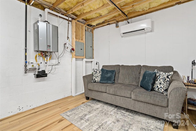 living room with a wall mounted air conditioner, wood-type flooring, electric panel, and water heater