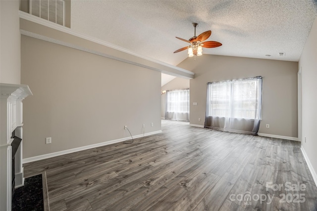 unfurnished living room featuring a textured ceiling, ceiling fan, wood-type flooring, and lofted ceiling