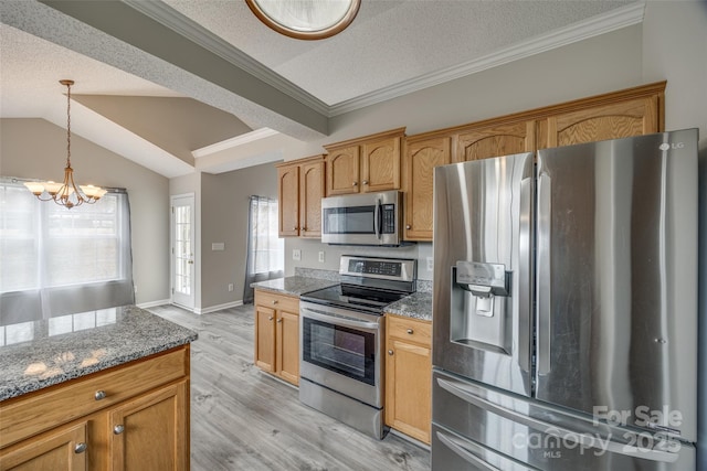 kitchen with a notable chandelier, a textured ceiling, appliances with stainless steel finishes, and dark stone counters