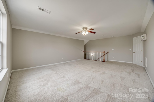 unfurnished room featuring light colored carpet and ceiling fan