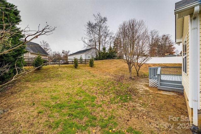 view of yard with a wooden deck