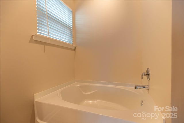 bathroom with a tub