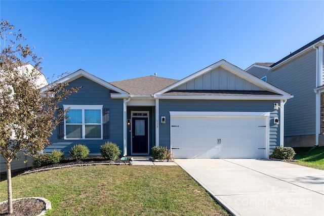 single story home with a front yard, an attached garage, board and batten siding, and driveway