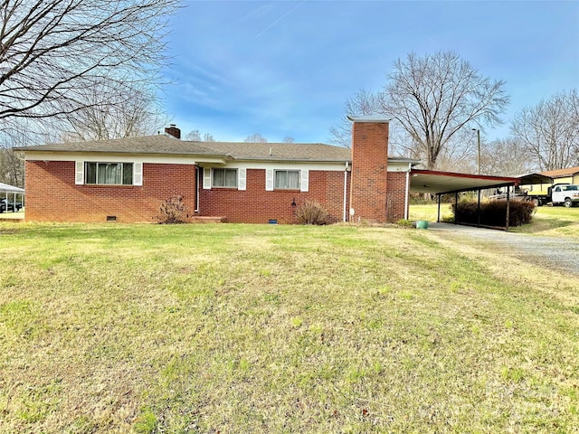 ranch-style house with a front lawn and a carport