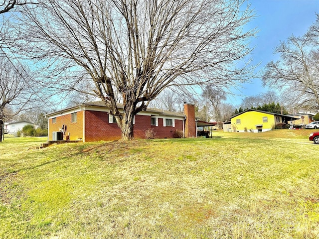 view of yard with central AC