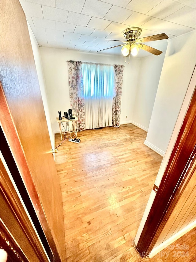 spare room with ceiling fan and light hardwood / wood-style floors