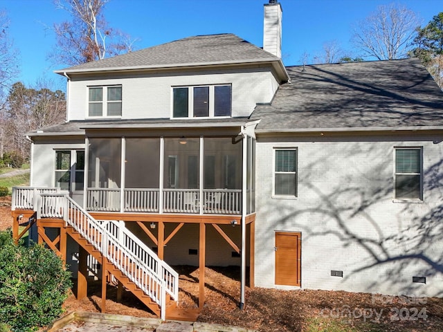 rear view of house with a sunroom