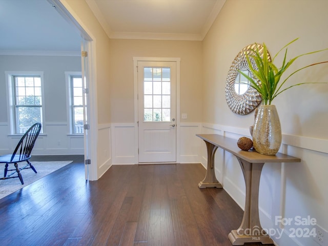 doorway with crown molding and dark hardwood / wood-style flooring