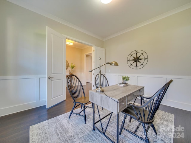 dining area with dark hardwood / wood-style flooring and ornamental molding