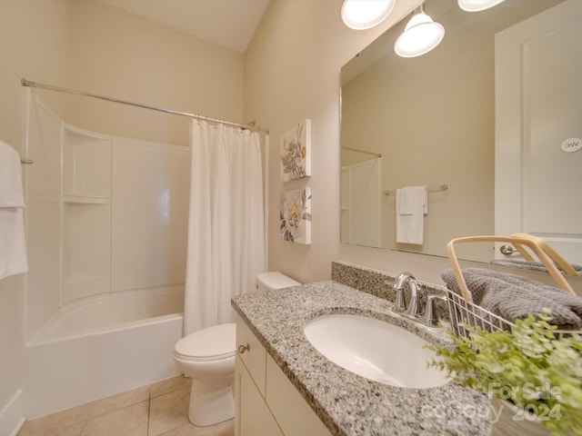 full bathroom with vanity, vaulted ceiling, shower / tub combo with curtain, tile patterned flooring, and toilet