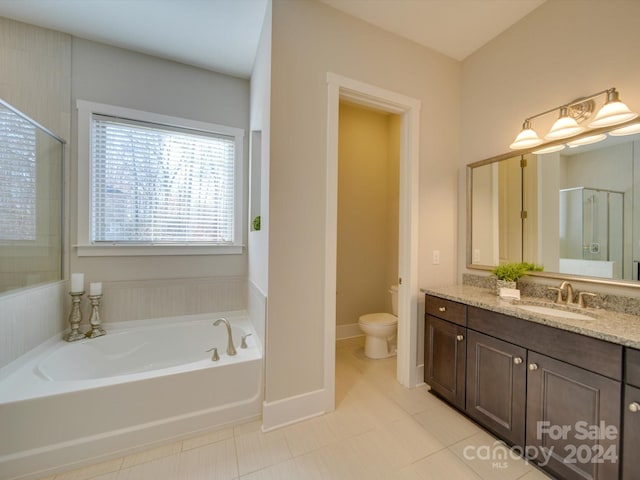 full bathroom with tile patterned flooring, vanity, toilet, and independent shower and bath