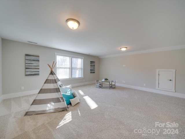 interior space featuring light colored carpet