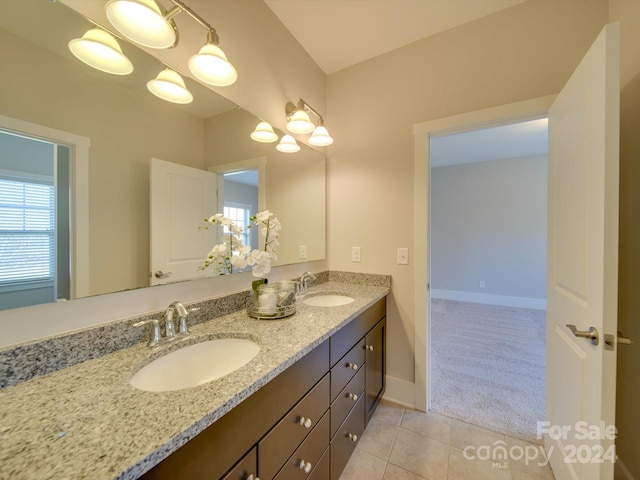 bathroom featuring tile patterned flooring and vanity