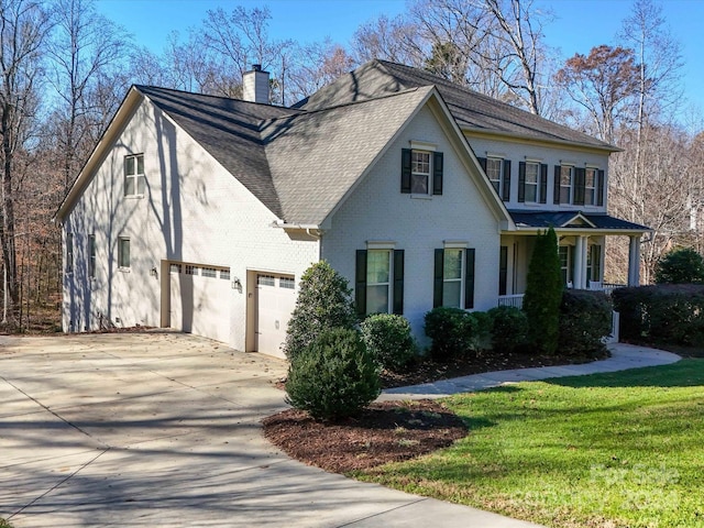 view of property exterior with a lawn and a garage