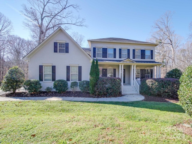 view of front of house with a porch and a front yard