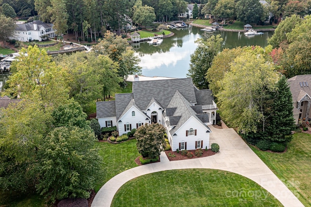 birds eye view of property with a water view