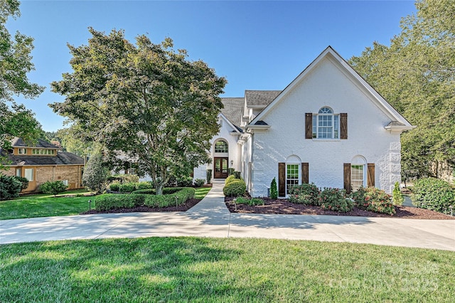 view of front of home with a front lawn