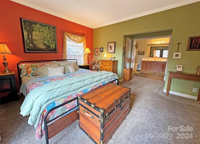 bedroom with carpet flooring, ornamental molding, and connected bathroom